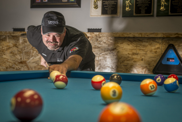 Like many billiards enthusiasts, Christopher Sanders has no pool table in his home, preferring instead to frequent a pool hall. His favorite is Premium Billiards, 228 Chapel Dr., Syracuse, which sponsors him. During the day he is an EEG technician at Upstate University Hospital.