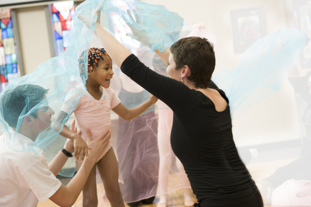 Upstate patient Miracle Thompson, 5, dances with Jowonio occupational therapist Lisa Neville, and is supported by Nottingham High School student and dancer, Bela Harris. The ballet program is sponsored by the Madeline Cote fund. Photo by Susan Kahn.