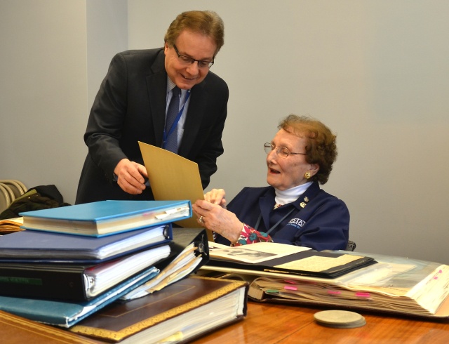 Upstate librarian Jim Capodagli and volunteer Muriel Diefendorf look over scrap books that were moved from Upstate‘s community-campus hospital to the historical collections at Upstate‘s Health Sciences Library.