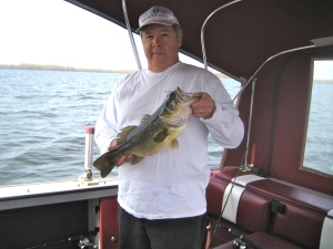 Darby on his boat on Onedia Lake.