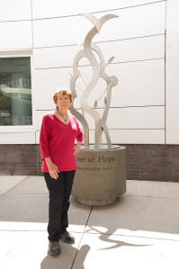 The artist, Steinfeld with her sculpture, which was installed July 9. Photo by Susan Kahn.
