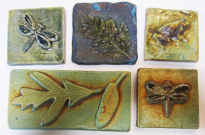 Ceramic tiles by Margie Hughto. Similar nature-themed wall sculptures will be in the new cancer center.