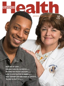 Brandon Hudson appears on the cover of Upstate Health magazine with living donor transplant coordinator Ellen Havens.