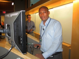 Otolaryngologist Asnake Kassa, MD, gave a talk at Upstate as part of his visit to America this fall. He presented case studies of patients and discussed Ethiopia's medical schools (there are three) and otolaryngology residency programs (there are none). In the background is Rick Kelley, MD.