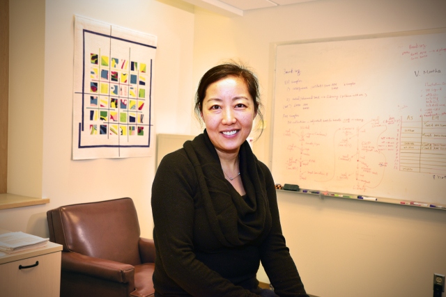 Wenyi Feng, PhD, is an assistant professor of biochemistry and molecular biology. (PHOTO BY WILLIAM MUELLER)