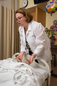 A patient's ability to move and feel sensation in the toes and fingers can help predict his or her recovery from stroke, that is one of the things brain injury medicine specialist Bernadette Dunn, MD, checks as she makes rounds.