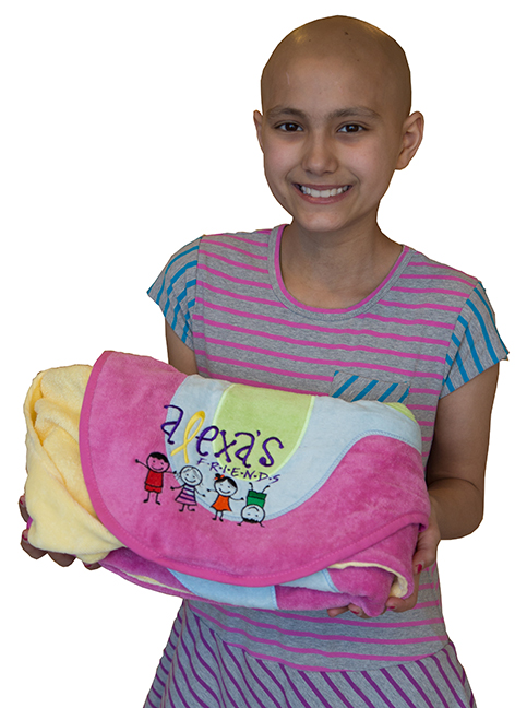 Alexa Bolton, 10, shows one of the fluffy character towels she distributes to pediatric cancer patients at Upstate Golisano Children's Hospital through a fund she established. (PHOTO BY KATHLEEN PAICE FROIO)