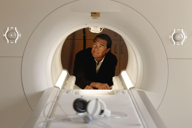 July 24, 2012 - San Francisco, California, United States: Dr. Michael Weiner, director of the San Francisco Veterans Affairs Medical Center for Imaging of Neurodegenerative Diseases, with the center's 3 Tesla Siemens Skyra MRI scanner, at the hospital. The imaging capabilities at the Veterans Health Research Institute, make it possible for the VA center to do leading research on Alzheimer's, aging veterans and Post Traumatic Stress Disorder. (Michael Macor/San Francisco Chronicle/Polaris)