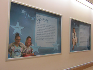 A hallway on the second floor of the downtown hospital has posters of employees who have been praised, in writing, by patients and family members.