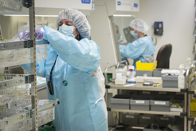 Pharmacy technicians Joanne McCollum and Jeremy Gleason at work in the Upstate Cancer Center. (PHOTO BY ROBERT MESCAVAGE)