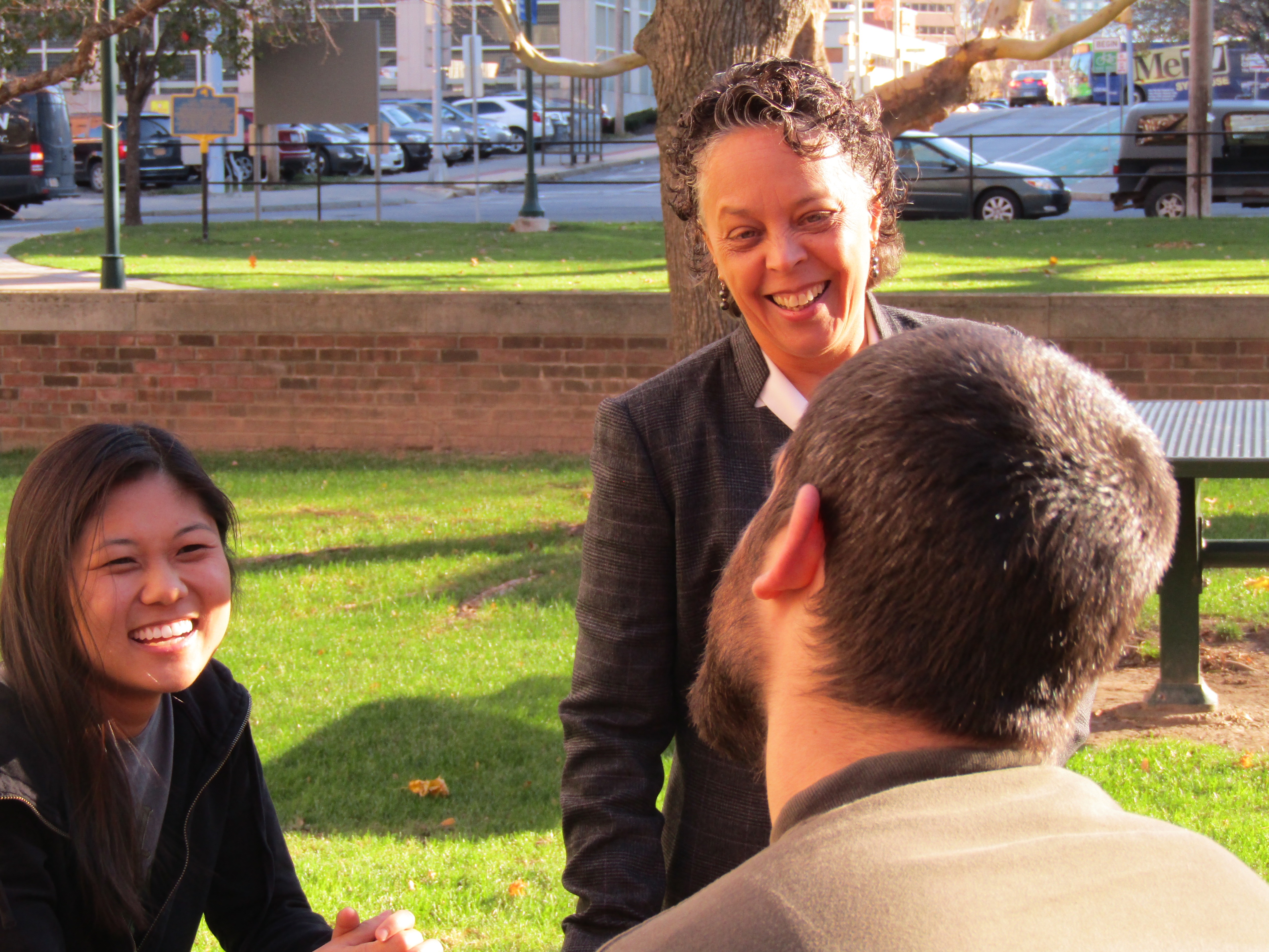 Upstate President Danielle Laraque-Arena, MD, FAAP, talks with students outside Weiskotten Hall. Photo by Susan Keeter