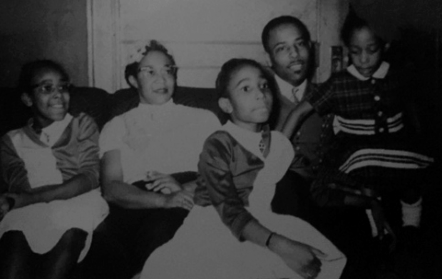 Maxine Thompson (then Summerhill), center, with her parents and sisters in their Syracuse home in the early 1960s.