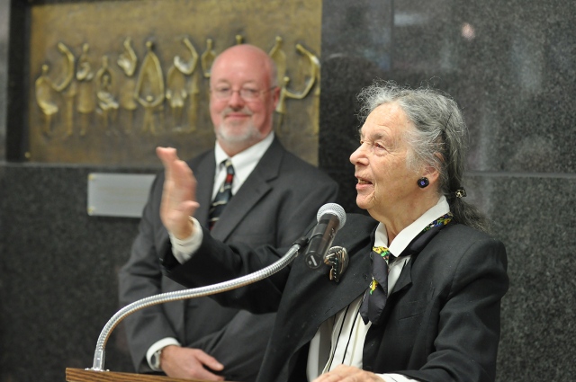 Dorothy Riester speaks at the 45th anniversary of the opening of Upstate University Hospital as hospital CEO John McCabe, MD, listens