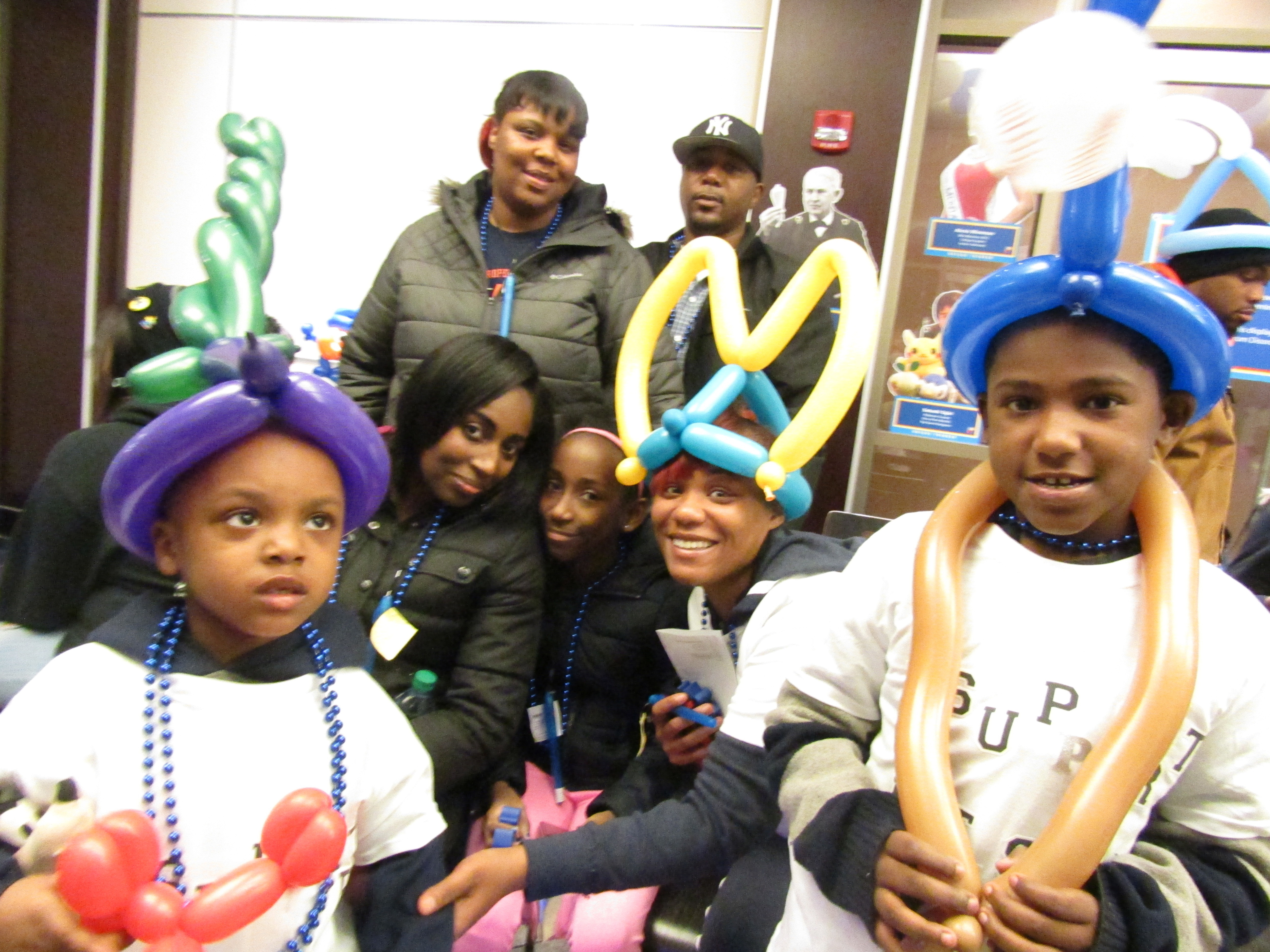Diablo, at left, has autism. He is pictured with his family at the Blue Lights for Autism celebration, hosted by Upstate's Margaret L. Williams Developmental Evaluation Center and the CNY Autism Association of America