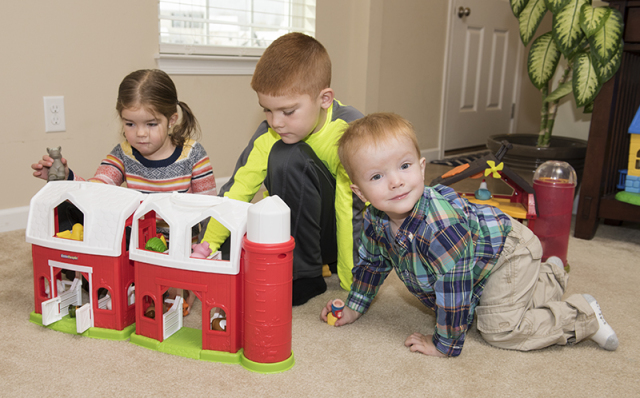 Mason at home with his sister, Ali, 4, and his brother, Christopher, 7. (PHOTO BY SUSAN KAHN)