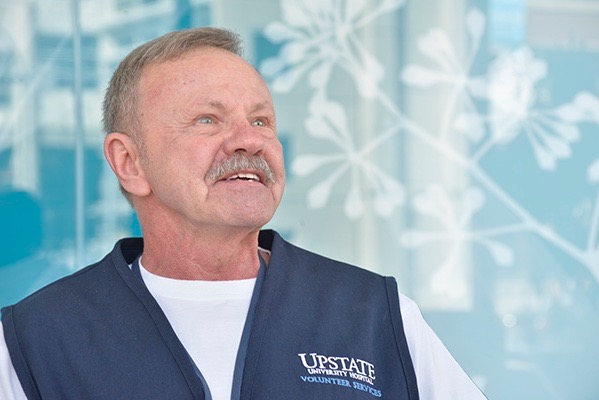 Glen Wells of Central Square volunteers at Upstate University Hospital one day a week. (PHOTO BY RICHARD WHELSKY)