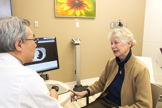 Seung Shin Hahn, MD, talks with his patient Dorette Thompson. (PHOTO BY WILLIAM MUELLER)