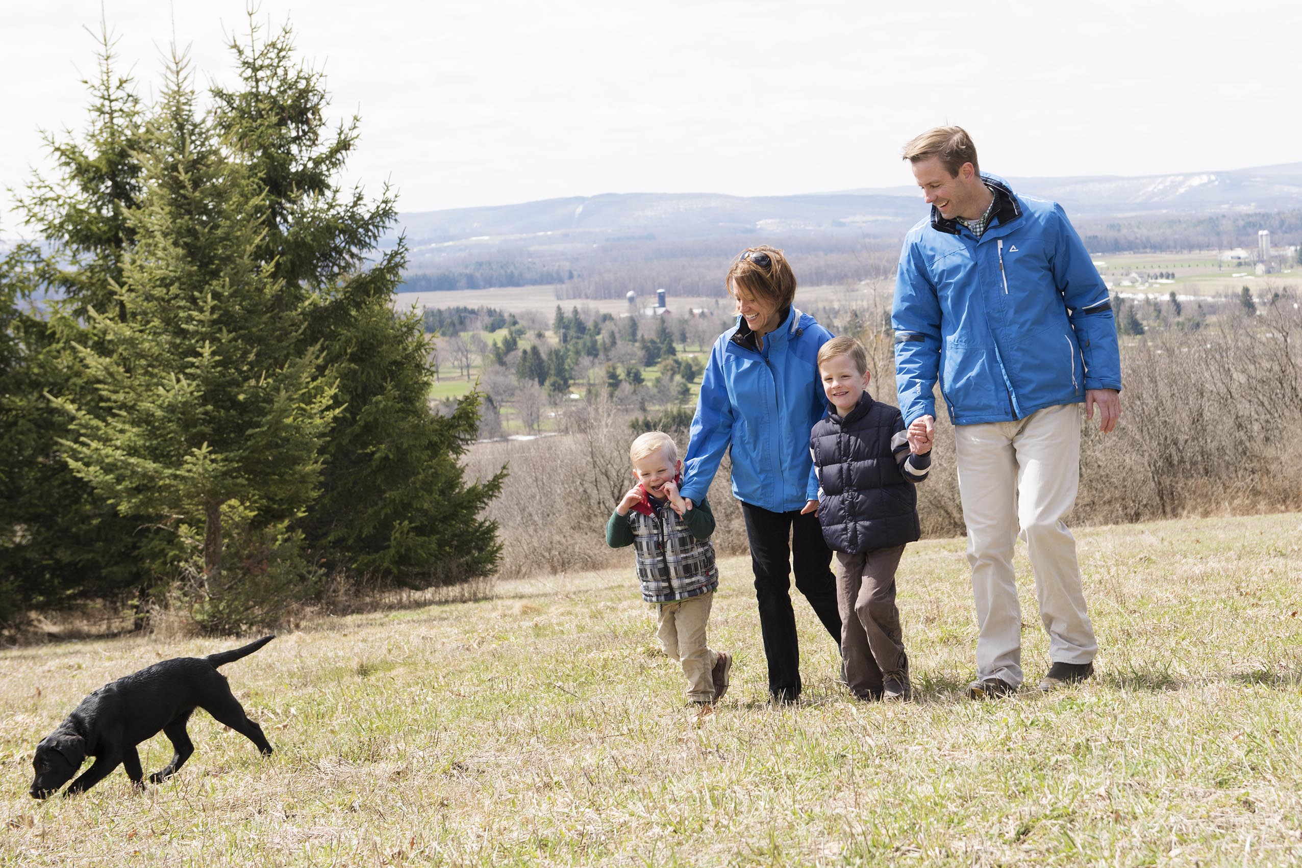 Several months after his stroke, Kyle Reger takes a walk with his wife, Martha Velky-Reger, and their sons, Jackson, left, and Max, this spring near their Cazenovia home. (PHOTO BY SUSAN KAHN)