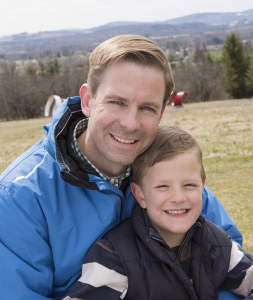 Reger with his son Max, 7, who is now considered free of cancer after being treated for WIlms' tumor as a toddler. (PHOTO BY SUSAN KAHN)