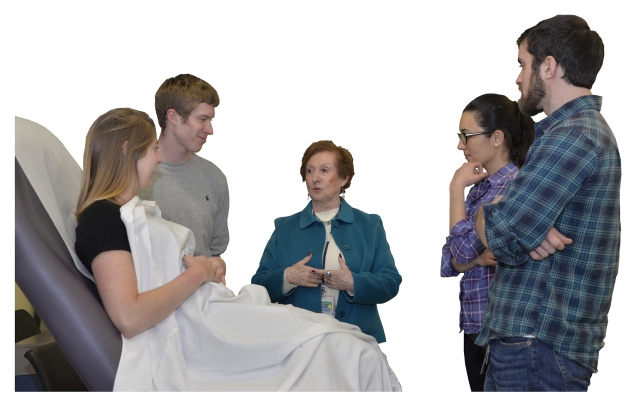 Maria-Lourdes Fallace (center) talks with students during the Medical Spanish course. Students (from left) are Laura Sxczesniak, Faniel Farrell, Dulce Barrios and Ryan Nightingale. (PHOTO BY WILLIAM MUELLER)