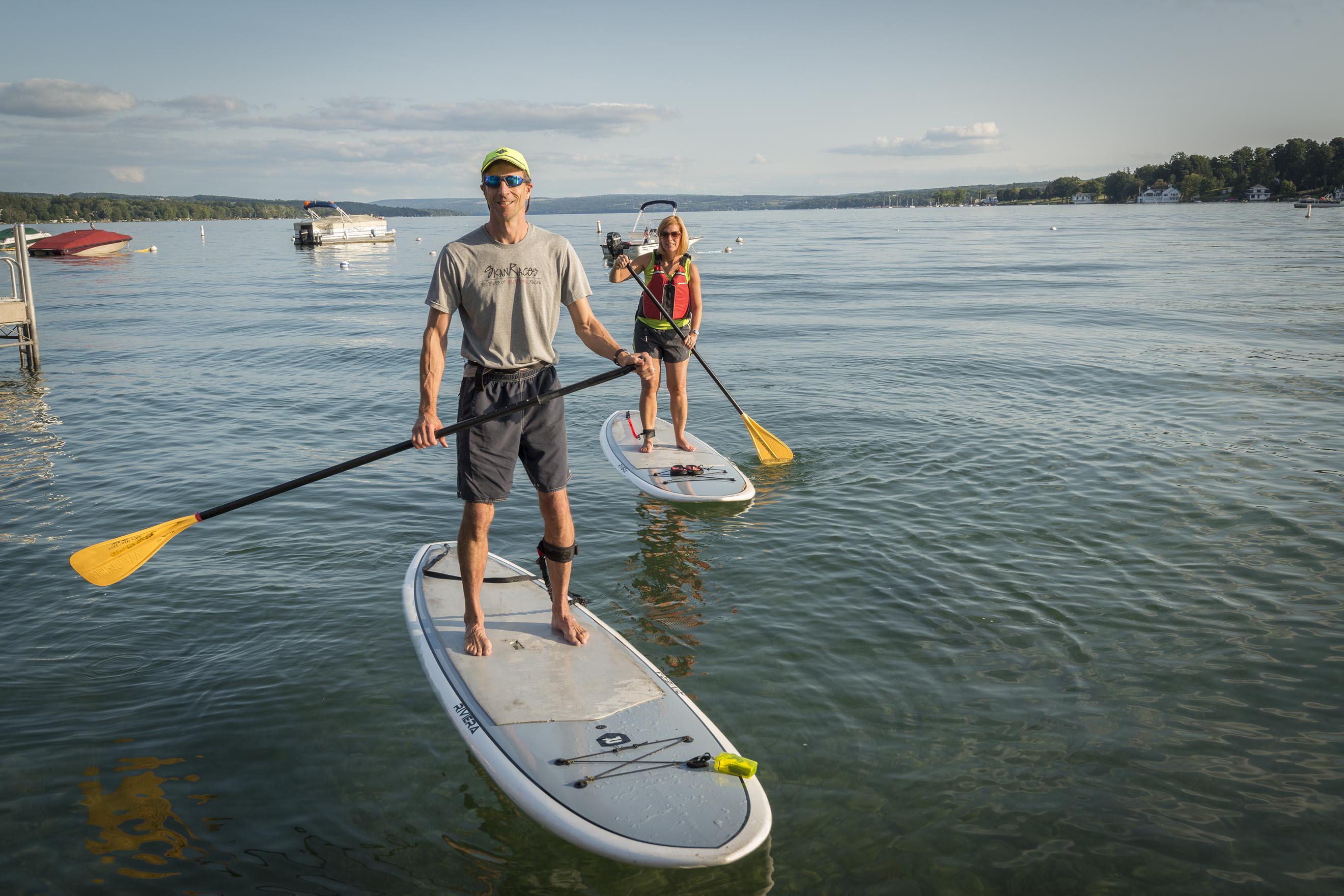 Kevin and Martha O'Keefe, who are both nurses at Upstate University Hospital, can often be found on paddleboards in Skaneateles Lake in the summertime. Their two young children like to come along, too. (PHOTO BY ROBERT MESCAVAGE)