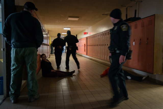 Upstate's trauma team trained with Syracuse emergency responders during a school shooting drill held at a vacant Syracuse school building in 2015. (PHOTOS BY ROBERT MESCAVAGE)