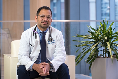Ajeet Gajra, MD, in the second-floor lobby of the Upstate Cancer Center. (PHOTO BY ROBERT MESCAVAGE)