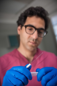 Hesham Masoud, MD, shows the clot retriever.