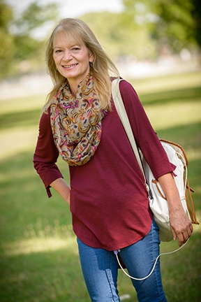 Rhonda Ferry carrying the backpack that holds a nutrition pump attached to her feeding tube. (PHOTO BY ROBERT MESCAVAGE)