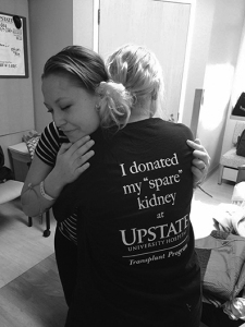 Fitzgerald (left) gives Adams a hug. (PHOTO BY KATE RUTHERFORD)