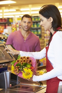 Woman cashier with flowers