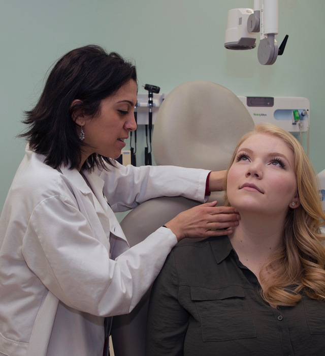 Upstate pathologist Rana Naous, MD, examines a spot in which a fine needle aspiration could be used to test a tumor in the neck for cancer. See the secondary story below for more on this procedure. (PHOTO BY WILLIAM MUELLER)
