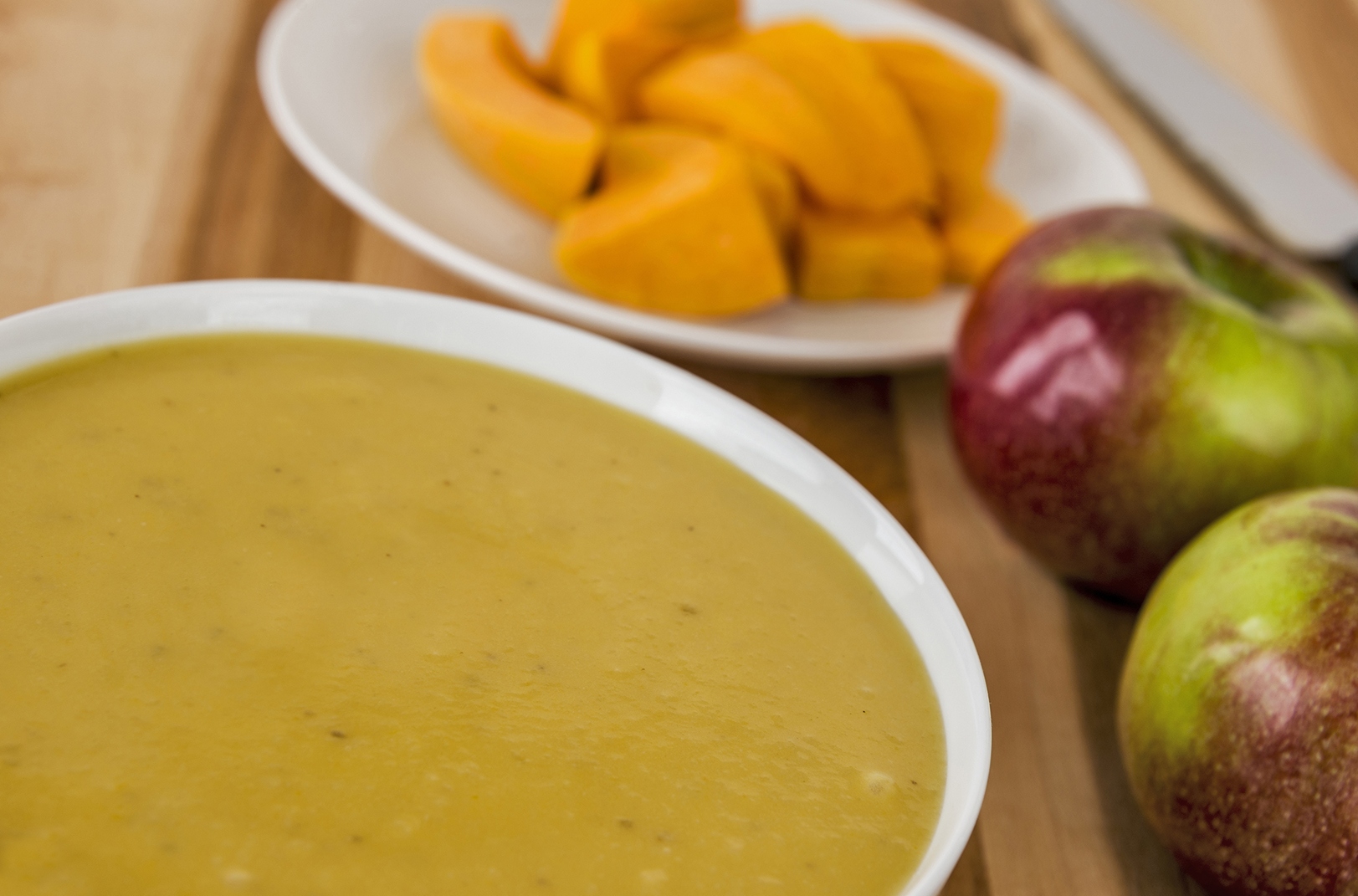 Acorn Squash and Apple Soup offers a soothing dish designed to be easily eaten by those with mouth sores or sensitive stomachs due to cancer treatment.