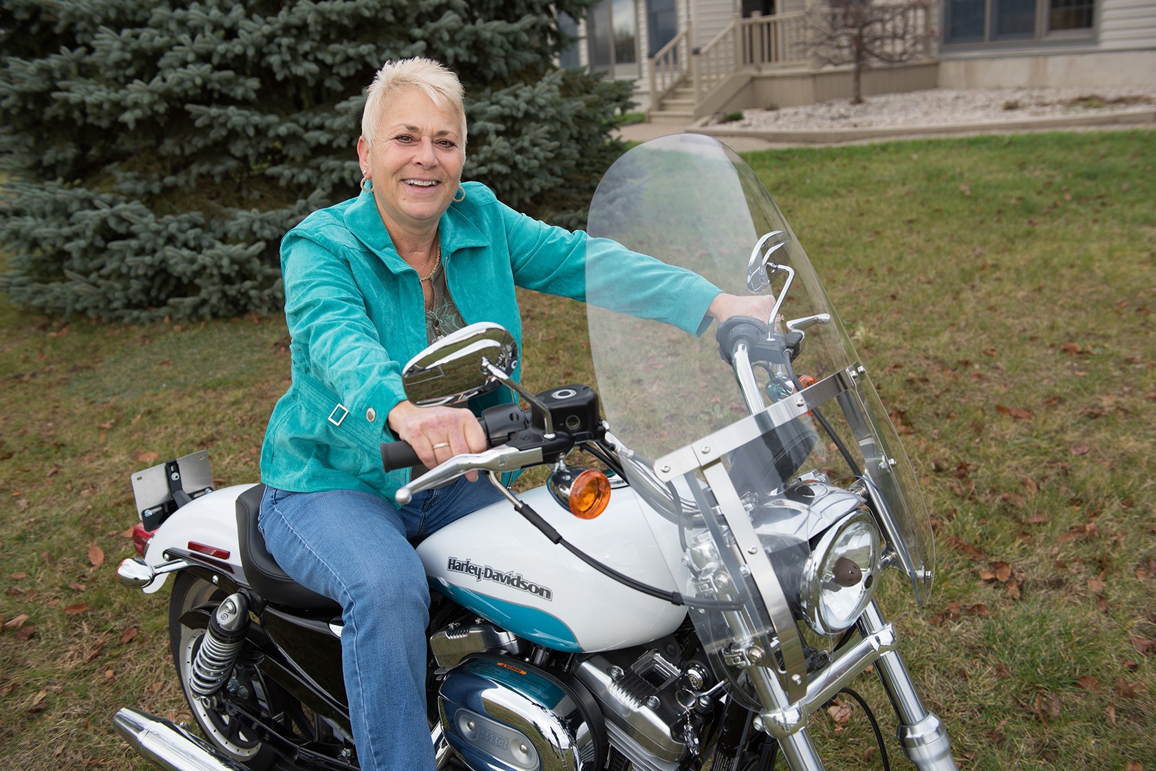 Toni Lindgren on the motorcycle she and her husband bought for her after her chemotherapy treatments for lung cancer. This winter, she plans to ride it along the eastern coast of Florida.