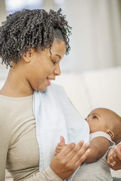 mother breast-feeding a baby