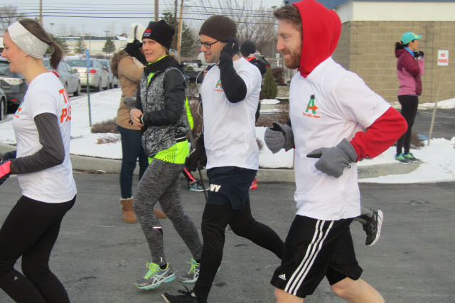 Third-year medical students Mary Powers, John Lofrese and Peter Congelosi — wearing I‘m with Alex t-shirts — start the run in support of Alex Paley. (photo by Susan Keeter)