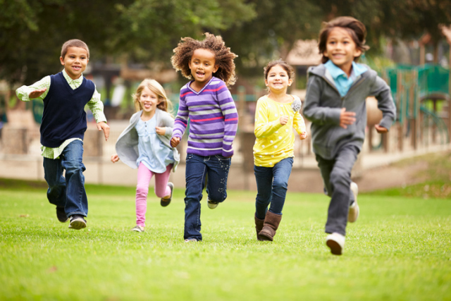 children running in a field, at play