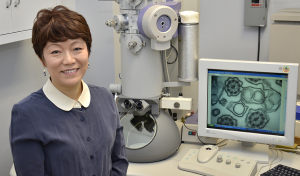Qi often uses an electron microscope as part of her job in Upstate's pathology department.