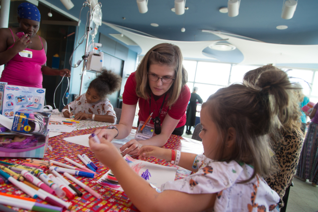 Fazzini hosts various art therapy group events, such as this Christmas in July project in the performance center that let children design holiday cards.