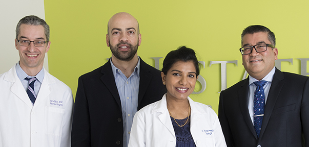 Members of the multidisciplinary melanoma team, from left: surgeon Scott Albert, MD, medical oncologist Adham Jurdi, MD, medical oncologist Abirami Sivapiragasam, MD (known as Abby Siva, MD), and surgical oncologist Ajay Jain, MD. (PHOTO BY SUSAN KAHN)
