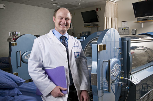 Marvin Heyboer, MD, at the hyperbaric medicine center. (PHOTO BY ROBERT MESCAVAGE)