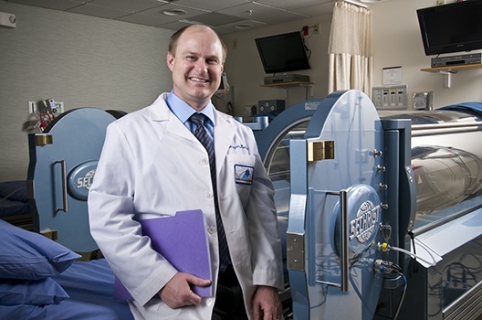 Marvin Heyboer, MD, at the hyperbaric medicine center. (PHOTO BY ROBERT MESCAVAGE)