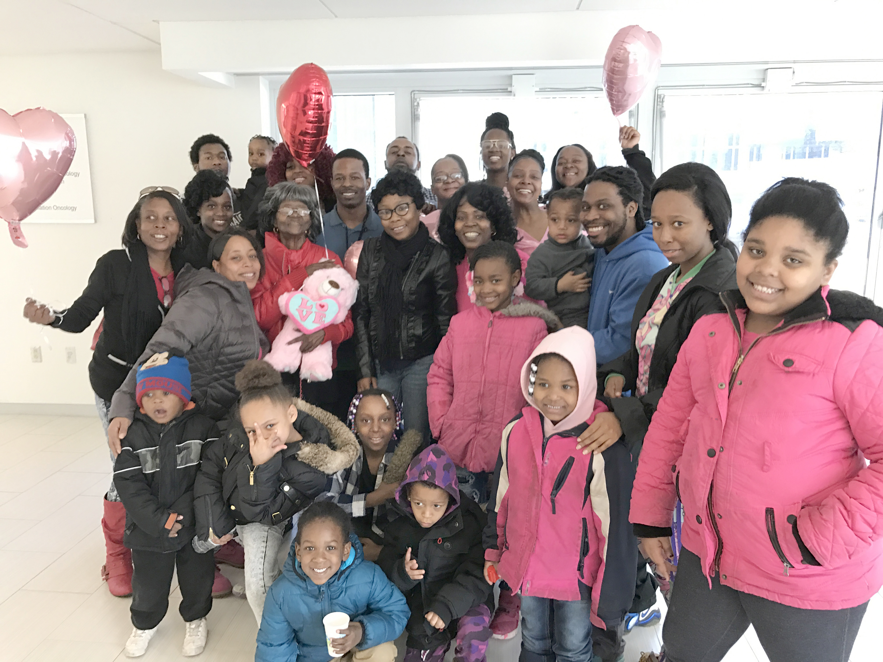 Ora Germany, 79, of Syracuse (holding the pink teddy bear) celebrated her last round of chemotherapy on Feb. 22 by ringing a bell in the Upstate Cancer Center, surrounded by loved ones including her four daughters and several grandchildren. She was diagnosed with stomach cancer in August 2016 and underwent 12 rounds of chemotherapy. She says her tumor got smaller during treatment. The Upstate Cancer Center features a bell on each of three treatment floors. Patients are invited to ring it when they finish treatment or reach a milestone.