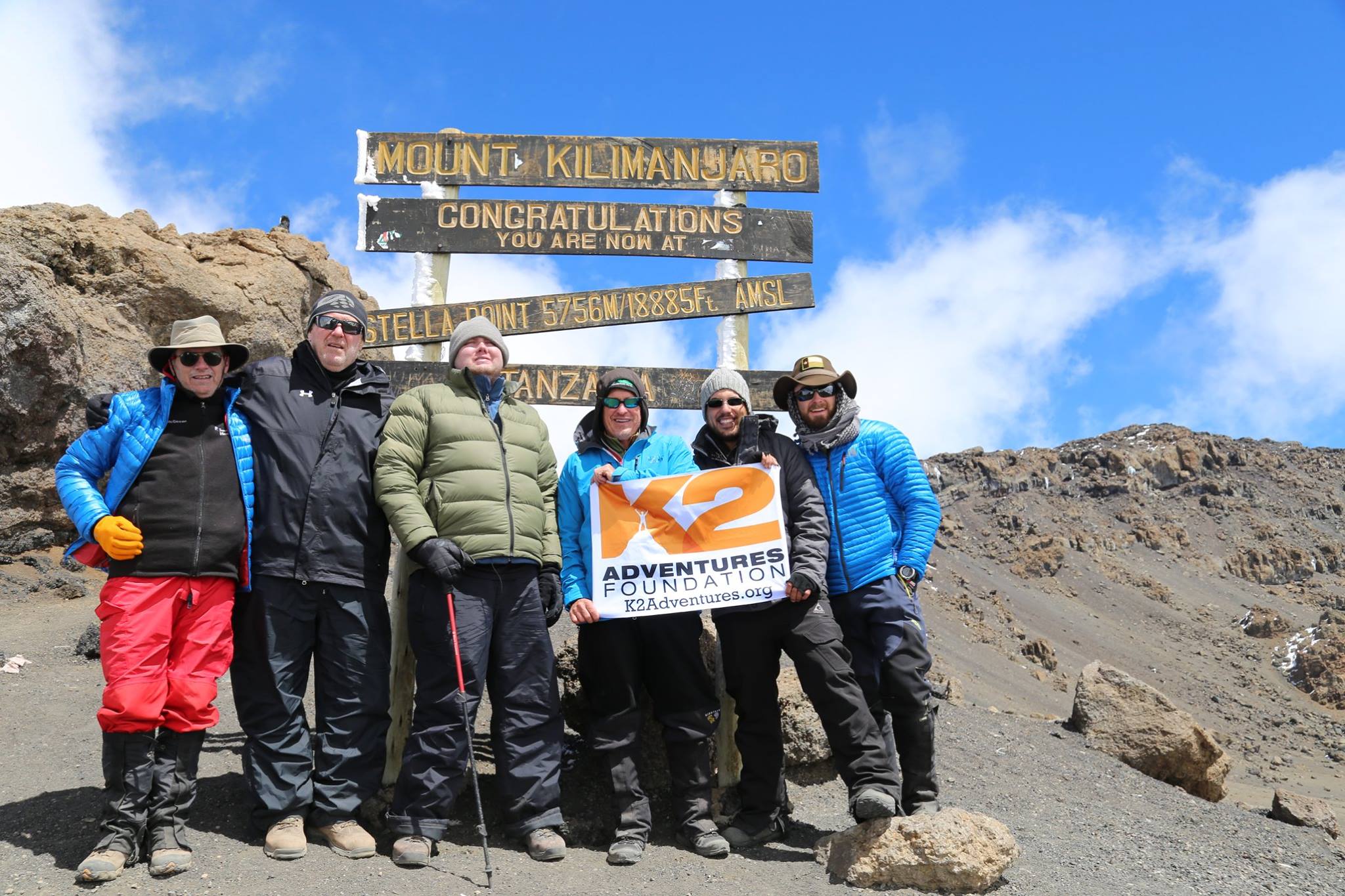 Tim Conners of Fulton, third from left, with his companions at the peak of Tanzania's Mount Kilimanjaro, Africa's highest peak, as shown on this photo from his Facebook page. The team reached the summit in early June.