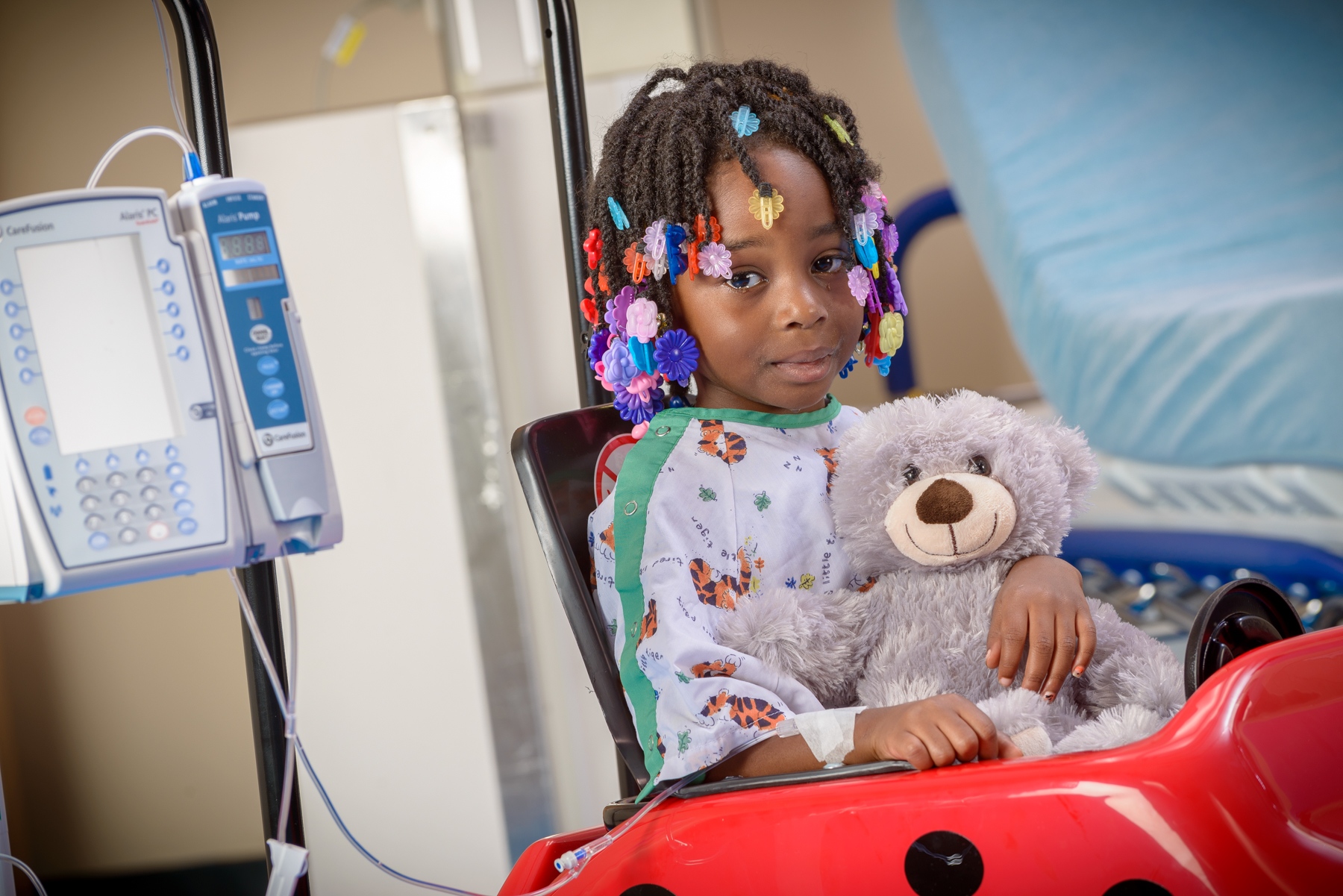 child in hospital bed PHOTO BY ROBERT MESCAVAGE
