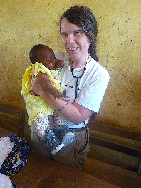 Nurse practitioner Brandy Baillargeon and a baby girl she provided care for in Ghana, West Africa.