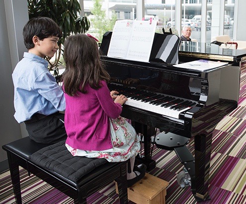 Kaelem, 12, and Elodie, 5, Michel of Fayetteville played soothing classical music at the Upstate Cancer Center for the enjoyment of patients and families, including their grandfather (pictured). Musicians can apply to perform at the center by contacting Matthew Capogreco at capogrem@upstate.edu or 315-464-3605 for an application and guidelines (PHOTO BY SUSAN KAHN)