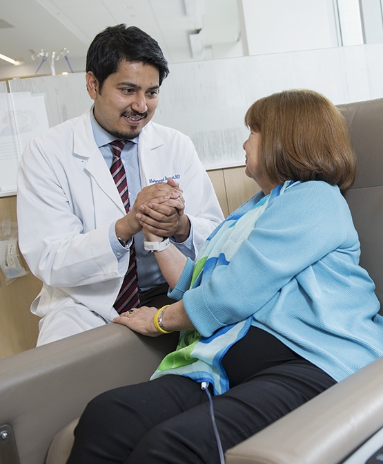 Foti with one of her oncologists, Muhammad Naqvi , MD, at the Upstate Cancer Center. (PHOTO BY SUSAN KAHN)