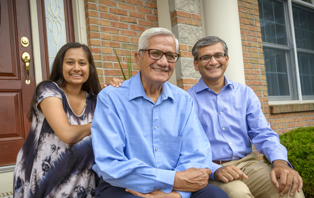 Stroke survivor Jagdish M. Saini, center, with his granddaughter, Rhea, and son, Rajeev Saini, MD, who did his internal medicine residency at Upstate. (PHOTO BY ROBERT MESCAVAGE)