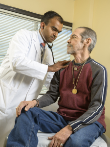 Upstate hepatologist Savio John, MD, checks on Barrera at a follow-up appointment.